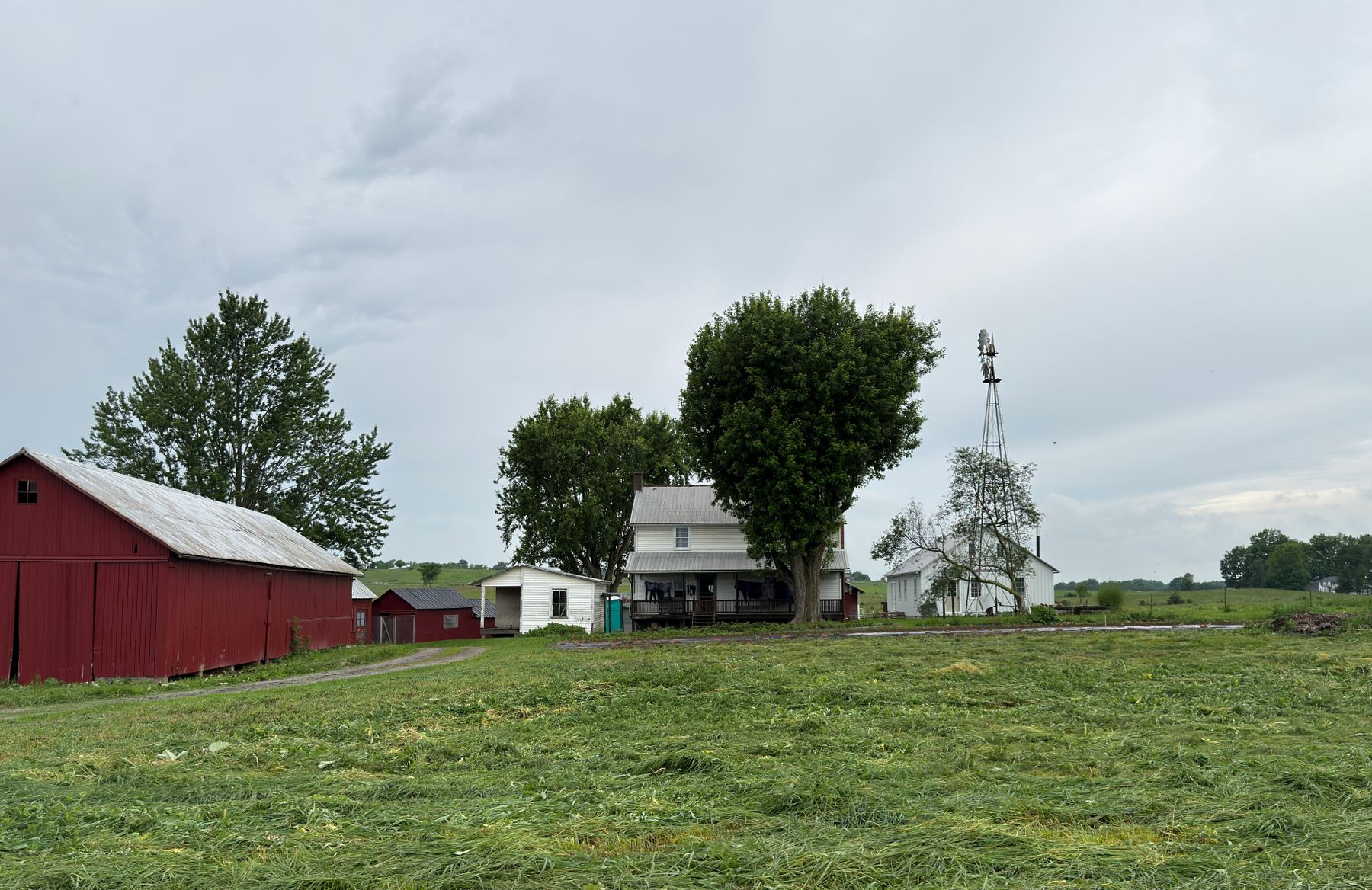 Farmstead in Ohio's Amish Country with red barn and windmill